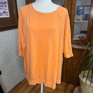 BLAIR SIZE X-LARGE ORANGE TOP WITH EYELET SLEEVES AND EMBROIDERY.